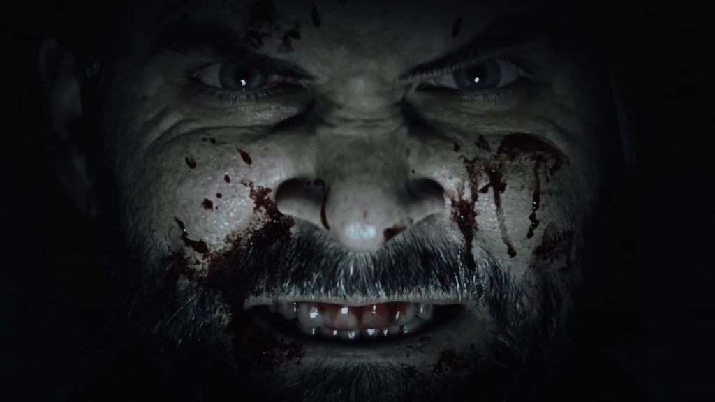 "Alan Wake 2" reveal trailer screenshot showing a bloody Alan as a jump scare.