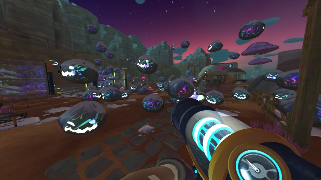 "Slime Rancher" screenshot showing your ranch at night and overrun with Tarrs.