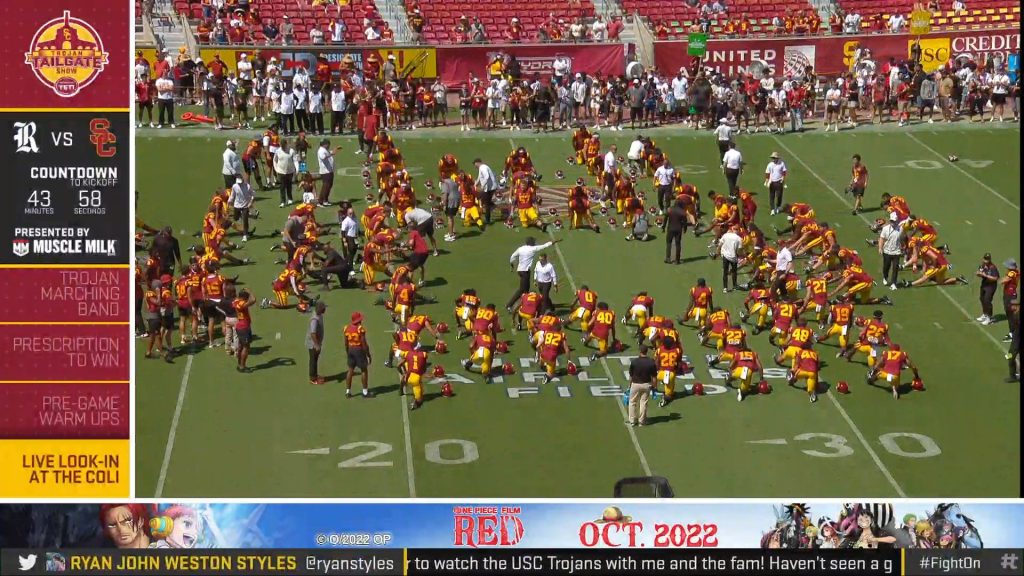 Still image of footage from USC Athletics, with an announcement for "One Piece Film: Red" in the bottom bar.