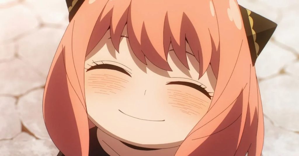 'Spy x Family' anime screenshot showing Anya with a big grin on her face.