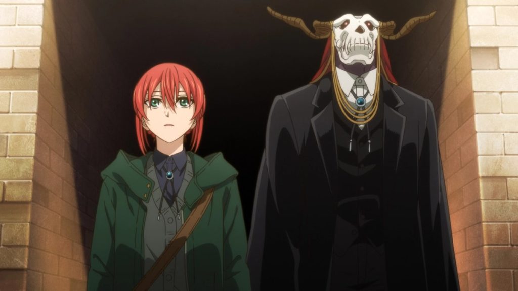 'The Ancient Magus' Bride season 2' Ep. 1 "Live and let live. II" screenshot depicting Chise and Elias standing together, staring in awe(?) at the College's interior.