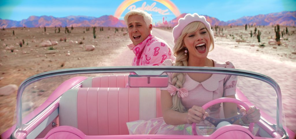 Margot Robbie as Barbie and Ryan Gosling as Ken, singing in Barbie's convertible 
