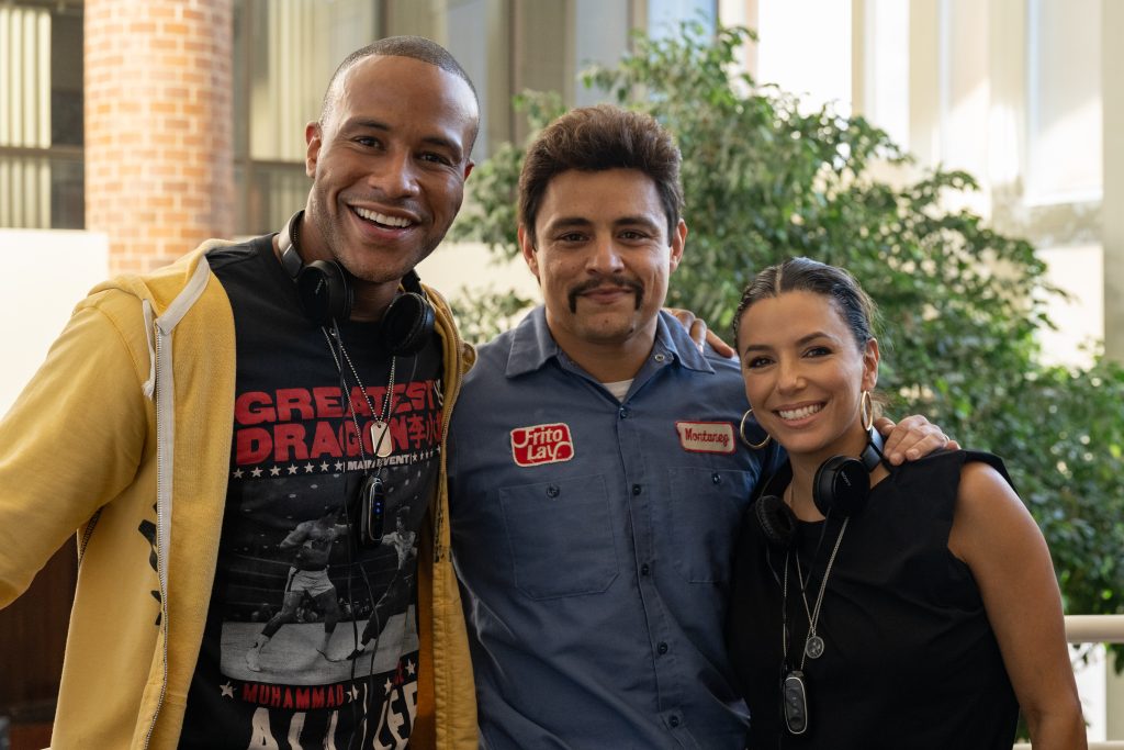 DeVon Franklin, Jesse Garcia, and Eva Longoria on the set of FLAMIN' HOT. Photo by Anna Koori’s. Courtesy of Searchlight Pictures. © 2023 20th Century Studios All Rights Reserved.