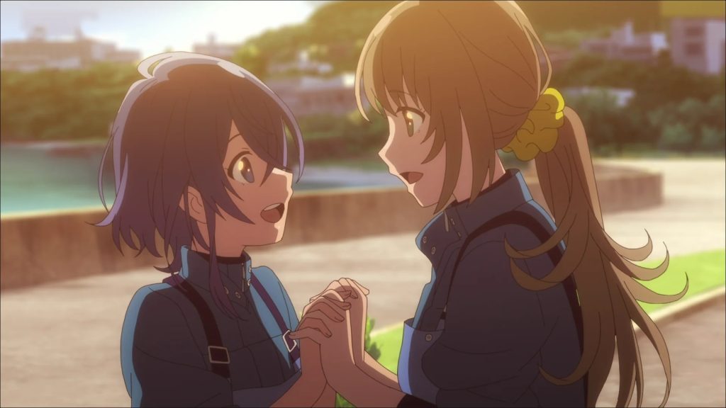 The Aquatope on White Sand screenshot depicting Kukuru and Fuuka holding hands with fingers intertwined and staring lovingly into each other's eyes.